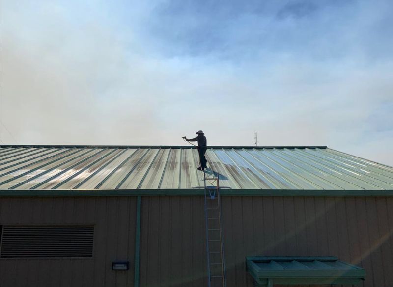 Me cleaning a roof for a commercial property in Tampa Bay.