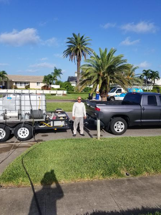 Me cleaning a driveway for a client in Tampa Bay area.